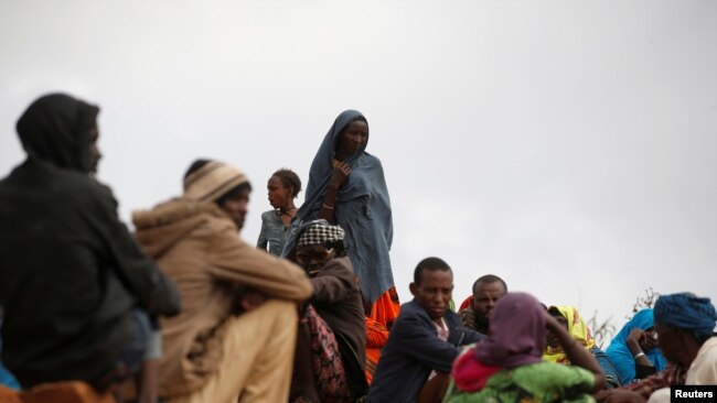 FILE - Ethiopian asylum seekers gather at the Somare refugee camp on the Ethiopian-Kenyan border near the town of Moyale, Kenya, March 27, 2018.