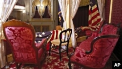 President Lincoln was sitting in a rocking chair, similar to this, in the presidential box at Ford's Theatre, now faithfully restored, when actor John Wilkes Booth snuck up behind him and shot him.