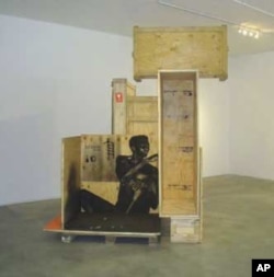 Nitegeka uses all kinds of scrap material for his art, including wooden crates