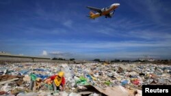 Garbage from a dumpsite like this one in Manila can be turned into fuel with new technologies. 