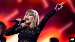 FILE - Taylor Swift performs at DIRECTV NOW Super Saturday Night Concert at Club Nomadic on Feb. 4, 2017, in Houston, Texas. 