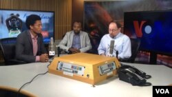 Ethiopian runner, silver medalist in Rio Olympics Feyisa Lilesa (L), his translator, and VOA reporter Dan Joseph at the Voice of America in Washington, Sept 15, 2016. (Photo: Rudan Balay / VOA) 