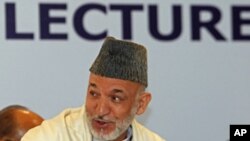 Afghan President Hamid Karzai before delivering a lecture on the second day of his two-day official visit, in New Delhi, Oct. 5, 2011
