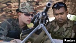 French soldiers man a checkpoint at the French controlled area of the Bamako airport, January 26, 2013.