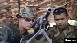 French soldiers man a checkpoint at the French controlled area of the Bamako airport, January 26, 2013.