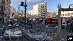 People assess the damage after an explosion in southeastern Turkish city of Diyarbakir, early Nov. 4, 2016. A large explosion hit the largest city in Turkey's mainly Kurdish southeast region on Friday, wounding several people.