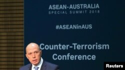 FILE - Australia's Home Affairs Minister Peter Dutton speaks at the opening of the Counter Terrorism Conference during the summit of the 10-member Association of Southeast Asian Nations (ASEAN) in Sydney, March 17, 2018.