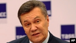 FILE - Former Ukraine President Viktor Yanukovych speaks at a news conference in Rostov-on-Don, Russia, Nov. 25, 2016. 