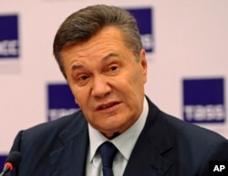 FILE - Ukraine's ousted president Viktor Yanukovych speaks at a news conference in Rostov-on-Don, Russia, Nov. 25, 2016.