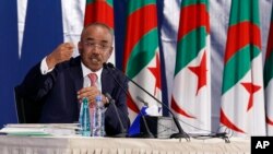 Algerian Interior Minister Noureddine Bedoui gestures during a press conference in Algiers, May 5, 2017.