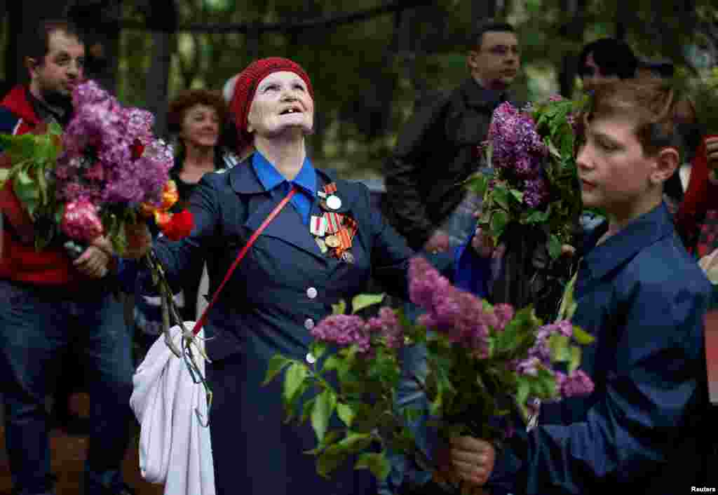 People attend the Victory Day celebration in Tbilisi, Georgia.