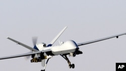 A MQ-9 Reaper unmanned aerial vehicle prepares to land after a mission in support of Operation Enduring Freedom in Afghanistan