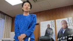 FILE - Eriko Yamatani, Japanese minister in charge of abductions, speaks during an interview with journalists at her office in Tokyo, Sept. 17, 2014. 