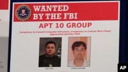 Ảnh hai tin tặc Trung Quốc bị FBI truy lùng vào năm 2018.