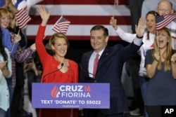 Republican presidential candidate Sen. Ted Cruz, R-Texas, joined by former Hewlett-Packard CEO Carly Fiorina, waves during a rally in Indianapolis, April 27, 2016, when Cruz announced he has tapped Fiorina to serve as his running mate.
