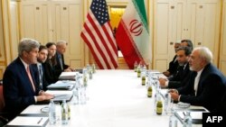 FILE - U.S. and Iranian delegations headed by Secretary of State John Kerry (L) and Iranian Foreign Minister Javad Zarif (R) are seen meeting in Vienna, Austria, Jan. 16, 2016. Critics on Capitol Hill have accused the Obama administration of a lack of transparanecy during Iran nuclear talks.
