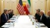 FILE - US Secretary of State John Kerry (L) meets with Iranian Foreign Minister Javad Zarif (2R) in Vienna, Austria on Jan. 16, 2016, on what is expected to be "implementation day," the day the IAEA verifies that Iran has met all conditions under the nuclear d