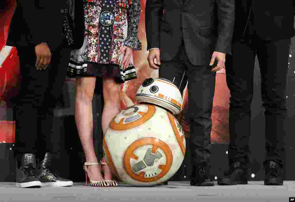 BB-8 droid poses with actors and the director during a press conference for their latest film &quot;Star Wars: The Force Awakens&quot; at a hotel in Urayasu, near Tokyo.