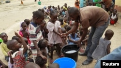 FILE - Children rescued from Boko Haram in Sambisa forest wash their hands at the Malkohi camp for Internally Displaced People in Yola, Adamawa State, Nigeria, May 3, 2015.