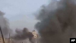 An image grab taken from a video uploaded on YouTube on February 6, 2012 shows what was described as shelling on the Baba Amr district of the restive city of Homs in central Syria.