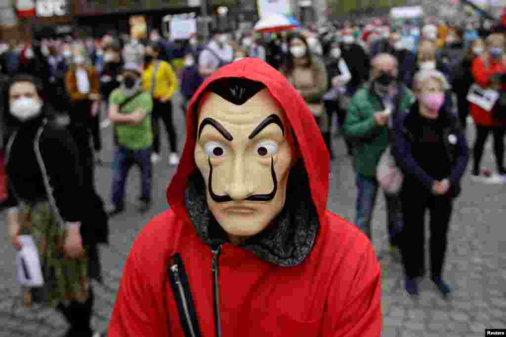 A demonstrator wearing a Salvador Dali mask attends an anti-government protest in Prague, Czech Republic.
