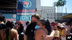 FILE - Demonstrators rally to demand continued access to abortion during the March for Reproductive Justice, Oct. 2, 2021, in downtown Los Angeles.