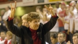 North Carolina State coach Kay Yow responds to the crowd with a Wolfpack salute