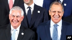 FILE - Russian Foreign Minister Sergey Lavrov, right, and U.S. Secretary of State Rex Tillerson stand together during the G-20 foreign ministers meeting in Bonn, Germany, Feb. 16, 2017.