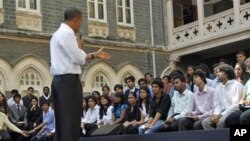 U.S. President Barack Obama on stage as he answers questions during a town hall meeting with students at St. Xavier's College in Mumbai, India, Sunday, Nov. 7, 2010. (AP Photo/Pablo Martinez Monsivais)