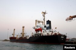 A ship carrying 5,500 metric tons of flour is docked at the Red Sea port of Hodeidah, Yemen, Nov. 26, 2017.