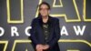 FILE: Peter Mayhew, who played Chewbacca in many Star Wars films, poses for photographers upon arrival at the European premiere of the film 'Star Wars: The Force Awakens ' in London, Dec. 16, 2015