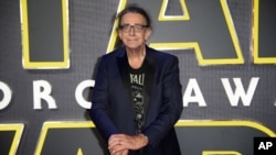 Peter Mayhew, who played Chewbacca in many Star Wars films, poses for photographers upon arrival at the European premiere of the film 'Star Wars: The Force Awakens ' in London, Dec. 16, 2015