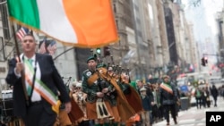 FILE - Bagpipers march up Fifth Avenue during the St. Patrick's Day Parade, March 16, 2019, in New York.
