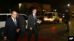FILE - In this Jan. 9, 2015 photo, U.N. Special Envoy to Libya Bernardino Leon, center, arrives in Tripoli for meetings. 