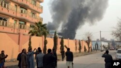 Smokes rises after a deadly suicide attack in Jalalabad, Afghanistan, Jan. 24, 2018.