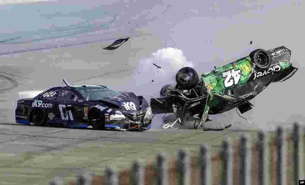 Kyle Larson (42) flips as he makes contact with Jeffrey Earnhardt (81) on the back stretch during a NASCAR Cup Series auto race at Talladega Superspeedway, April 28, 2019, in Talladega, Alabama.