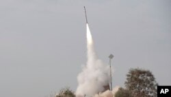 FILE - An Israeli missile is launched near the city of Be'er Sheva, southern Israel, Nov. 17, 2012. On Monday, Israel launched a missile at a Syrian military site in what it said was a retaliatory strike.