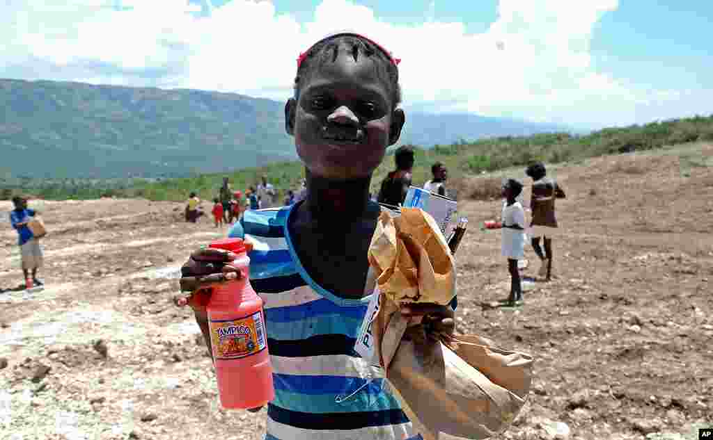 [국제구호단체의 아이티 재건 현장] 폐허 속에서 희망을 퍼올리는 사람들
