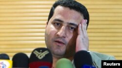 FILE - Iranian scientist Shahram Amiri speaks to journalists as he arrives at the Imam Khomini Airport in Tehran, July 15, 2010. Iran has executed id Amiri who was convicted of giving top secret information about Tehran's controversial nuclear program to the United States.