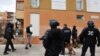 French policemen participate in an operation to fight against narcotics and weapons proliferation at Bassens estate in the northern area of Marseille, southern France, January 12, 2012.