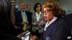 FILE - Then-congresswoman Corrine Brown talks with reporters in Tallahassee, Florida, Aug. 13, 2015.