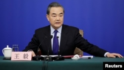China's Foreign Minister Wang Yi attends a news conference during the ongoing National People's Congress (NPC), China's parliamentary body, in Beijing, China, March 8, 2018.