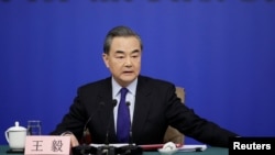 China's Foreign Minister Wang Yi attends a news conference during the ongoing National People's Congress (NPC), China's parliamentary body, in Beijing, China, March 8, 2018. 