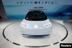 A Volkswagen I.D. electric vehicle is shown at a news conference in Guangzhou, China, Nov. 17, 2016.