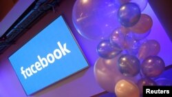 FILE - Balloons are seen in front of a logo at Facebook's headquarters in London, Dec. 4, 2017. 