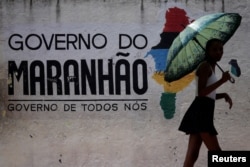 A woman leaves a polling station during municipal elections in Sao Luis, Brazil, Oct. 2, 2016.