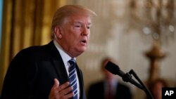 President Donald Trump speaks during an event on prison reform in the East Room of the White House, May 18, 2018, in Washington.