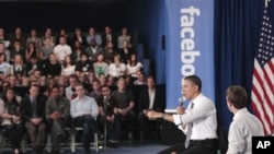 President Barack Obama and Facebook CEO Mark Zuckerberg take part in a town hall meeting to discuss reducing the national debt, April 20, 2011, at Facebook headquarters in Palo Alto, Calif.