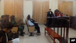 Former opposition leader Kem Sokha, center, sits in a court room of the appeals court, in Phnom Penh, Cambodia, Thursday, Feb. 1, 2018. An appeals court in Cambodia on Thursday denied a second request for the release on bail of opposition leader Kem Sokha, who has been charged with treason. (Pool via AP)