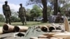Kenyan Wildlife wardens keep a watch on confiscated elephant tusks at the Kenyan wildlife offices in Nairobi, Nov. 30, 2009
